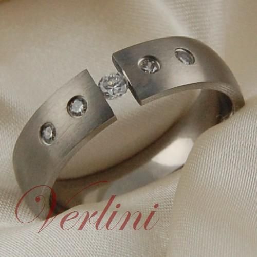   wedding band ring with one center white cubic zirconium diamond and