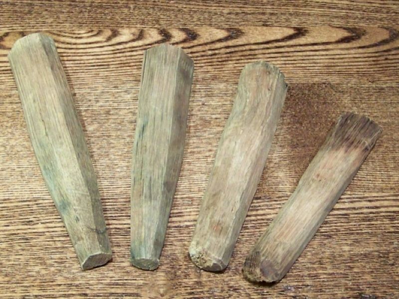 These wood spikes were hand carved and weathered over time. They are 