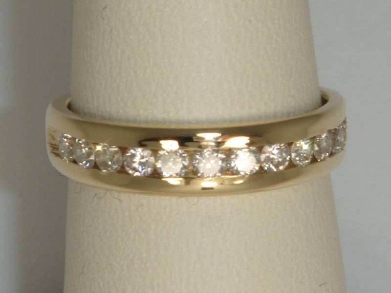 STUNNING CHANNEL SET DIAMOND BAND APPROX. 1/2 CARAT TW  