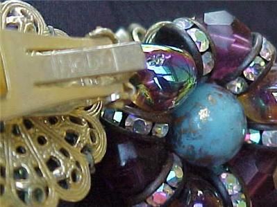   rhinestones & large blue stone in the centerVery good condition