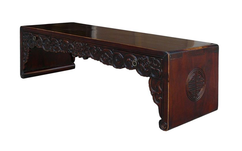   this kang low coffee table has the traditional chinese scroll legs