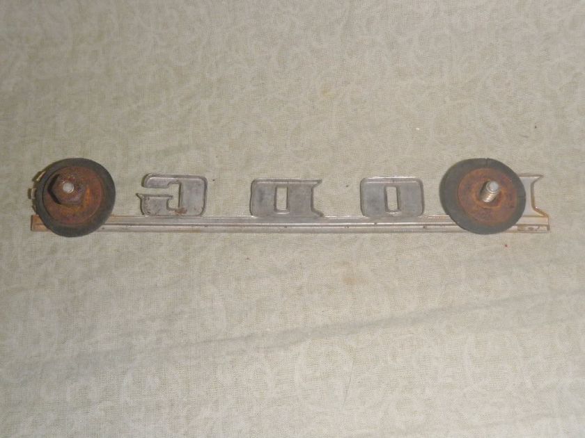   emblem ornament plaque nameplate metal truck car fender trunk  